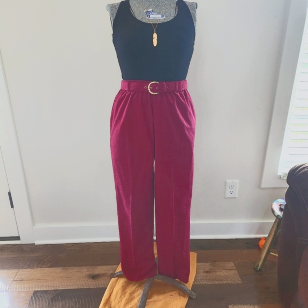 VINTAGE MAROON VELVET PANTS WITH GOLD BELT BUCKLE.
